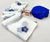White Linen Saree with Blue Floral Print & Orange Accents | Elegant Printed Linen Saree for Women